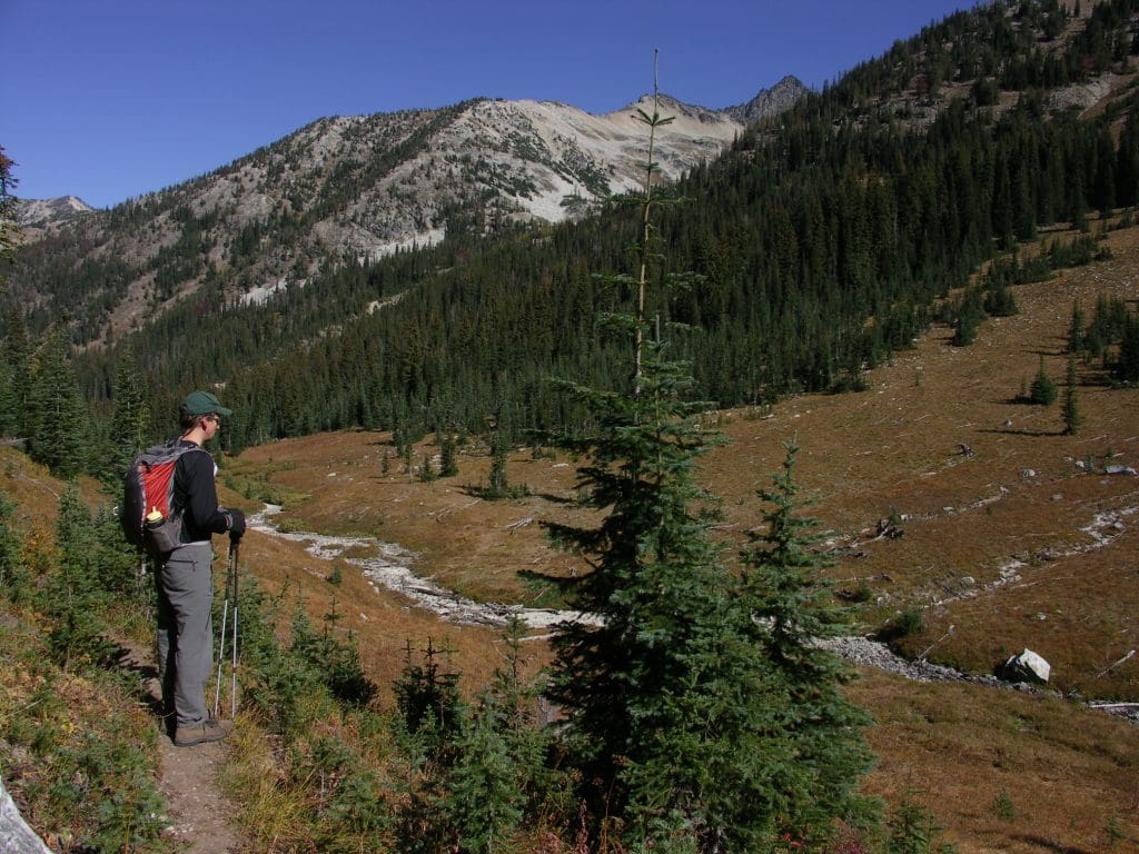 April 2022 - Park of the Month 15 Hiker in meadows on Boulder Creek Trail